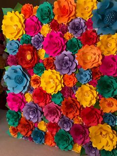 colorful paper flowers arranged in the shape of a square