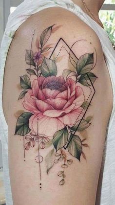 a rose tattoo on the back of a woman's left shoulder and upper arm