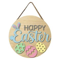 a wooden sign that says happy easter with cookies and eggs on the front, hanging from a