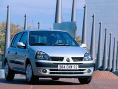 a silver car parked on the side of a road