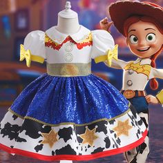 the toy is wearing a dress made out of cowgirl's fabric and has a cowboy hat on it