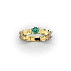 Discover the embodiment of love in our dainty engagement ring, expertly crafted in Italy with your choice of 14k or 18k gold setting. Choose from a selection of precious stones, including emerald, ruby, and blue sapphire, to symbolize your unique journey. The ring's raw, dusty surface exudes authenticity, while polished edges add a touch of refinement. Embrace the sentiment of your commitment with a piece that marries Italian craftsmanship and personal significance, capturing the beauty of imper Green Ring With Single Diamond In Fine Jewelry Style, Emerald Ring With Single Diamond For Anniversary, Green Diamond Ring In Fine Jewelry Style, 14k Gold Emerald Ring For Promise, May Birthstone, Fine Jewelry Emerald Ring With Single Diamond, Fine Jewelry Emerald Ring With Tension Setting, 14k Gold Emerald Promise Ring, May Birthstone, Elegant Stackable Emerald Rings With Bezel Setting, Fine Jewelry Rose Gold Emerald Ring