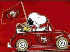 a snoopy car with a football player in the back and a san francisco state flag