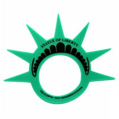 the statue of liberty ring is green and has spikes on it's sides, with an inscription made in usa