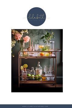 a bar cart filled with drinks and lemons