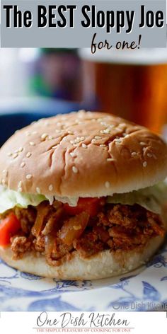 a pulled pork sandwich with lettuce and tomato