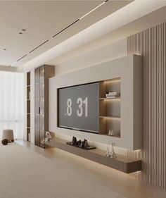 an empty room with a large television on the wall