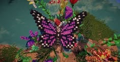 an image of a butterfly made out of legos on the ground with flowers and plants