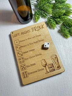 a wooden sign with dices and drinks on it