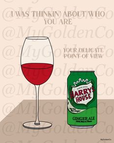 a wine glass next to a can of harry's house ginger ale on a table