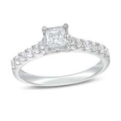 Express your love simply and sweetly with this sublime diamond engagement ring. Crafted in 14K white gold, this sophisticated choice features a 1/3 ct. princess-cut diamond - artfully set to enhance size and sparkle. Round diamonds line the shank for a classic look. Radiant with 3/4 ct. t.w. of diamonds and a brilliant buffed luster, this engagement ring appeals to her timeless taste. Princess Cut Diamond Ring With Prong Setting For Proposal, White Princess Cut Diamond Ring In Platinum, White Platinum Diamond Ring Princess Cut, White Asscher Cut Promise Ring, White Square Cut Promise Ring, Promise Ring With Princess Cut And Diamond Accents, Proposal Ring With Princess Cut And Vvs Clarity, Proposal Ring With Vvs Clarity Princess Cut, Princess Cut Diamond Accents Promise Ring