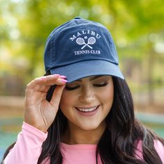 We want to see you in this cutie! This cap has a beautiful navy color and a sweet embroidered design that is perfect for the tennis lovers out there! The comfy fit and sleek design is great for all day wear! Casual Curved Brim Baseball Cap For Tennis, Casual Baseball Cap With Curved Brim For Tennis, Casual Snapback Tennis Hat, Casual Navy Hats For Sports Events, Navy Cotton Sporty Hat, Casual Snapback Trucker Hat For Pickleball, Casual Tennis Visor Hat, Sporty Snapback Hat For Tennis, Casual Hats With Cotton Sweatband For Sports Events