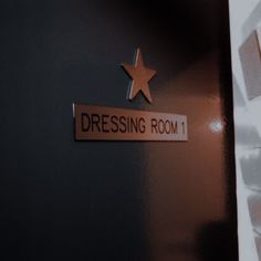 there is a sign that says dressing room 1