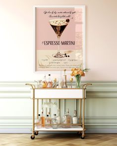 a bar cart with drinks on it in front of a pink wall and wooden floor