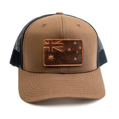 From the Land Down Under to the Top of Your Head The cap presents a tribute to Australian heritage with a beautifully crafted leather patch that features the iconic Southern Cross and Union Jack, symbols of the Australian flag. The deep, earthy tones of the leather patch resonate with Australia's rugged landscapes, while the meticulous stitching pays homage to the enduring Aussie spirit. Each cap is enhanced with a unique leather patch, subtly showcasing our dedication to durability and design.