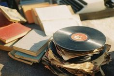 an old record player sitting on top of books