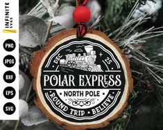 a polar express ornament hanging from a tree