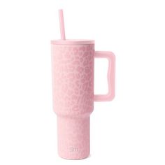 a pink cup with a straw sticking out of it's side, on a white background