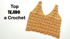 an orange crochet top with the words top tejo a crochet on it