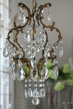 a chandelier hanging from the ceiling in a room