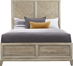 a bed with two drawers underneath it and pillows on the headboard, in front of a white background