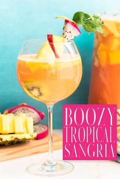 boozy tropical sangria with fresh fruit and mint garnish