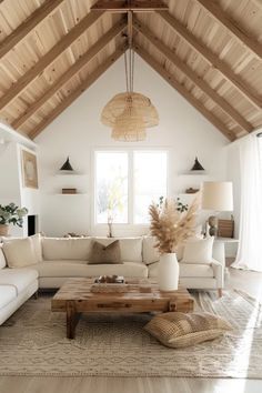 a living room filled with furniture and a large window covered in wood planks on the ceiling