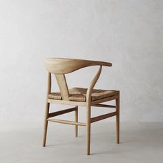 a wooden chair sitting on top of a white floor