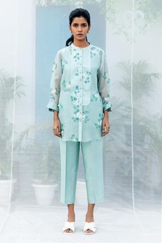 Mint shirt with sakura floral prints, embroidered highlights and criss-cross stitch line yoke. Comes with pant and slip. - Aza Fashions Spring Festive Chikankari Pant Set, Spring Festive Blouse With Set-in Sleeves, Blue Floral Embroidery Pant Set For Spring, Blue Floral Embroidered Pant Set For Spring, Festive Spring Blouse With Set-in Sleeves, Blue Pant Set For Spring Workwear, Traditional Spring Workwear Sets, Blue Chikankari Embroidery Sets For Spring, Embroidered Straight Pant Set For Spring