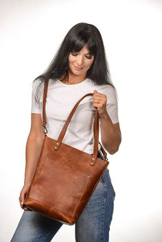 ●This handmade women tote bag with zipper is produced of full grain leather. It has one large compartment and has two pockets - inside and outside. It holds the shape perfectly and you may be confident that your personal things like phone, tablet, lap-top are safe. This bag is simple, reliable, and durable. Its universal look allows to use the tote bag for various purposes. One may take the bag to the work, shopping, in university, meeting, or walk and feel comfortable with it at any conditions. Weekender Bag With Leather Handles For Everyday Use, Leather Handles Weekender Shoulder Bag, Everyday Crossbody Weekender Bag, Leather Handles Crossbody Weekender Bag, On-the-go Weekender Bag With Double Handle, Adjustable Strap Weekender Shoulder Bag, Brown Weekender Bag With Leather Handles, Rectangular Weekender Bag For Everyday Use, Leather Weekender Bag For Everyday Use