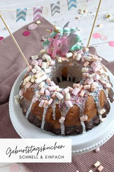 a bundt cake with marshmallows and sprinkles on it