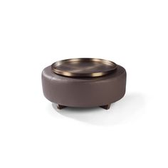 a small round stool with a metal lid