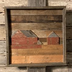 a wooden box with some buildings in it