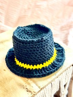 a crocheted hat is sitting on top of a table