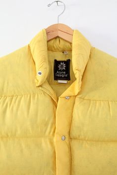 vintage puff vest,  men's camp vest,  yellow ski vest Tan Bubble Vest Men, Cheap Yellow Outerwear For Outdoor Activities, Cheap Yellow Sleeveless Vest, Cheap Yellow Tank Vest, Cheap Yellow Vest For Women, Orange Flower Puffer Vest, Cheap Yellow Women's Vest, Affordable Sleeveless Yellow Vest, Yellow Pfft Vest