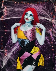 a woman with red hair and makeup is dressed in costume