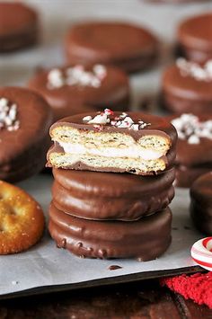 several chocolate covered cookies stacked on top of each other