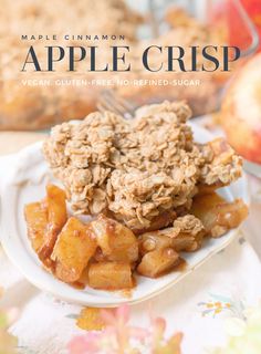 the cover of maple cinnamon apple crisp on a white plate with apples in the background