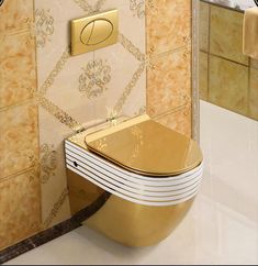 a gold toilet sitting in the corner of a bathroom