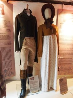 two mannequins dressed in period clothing on display