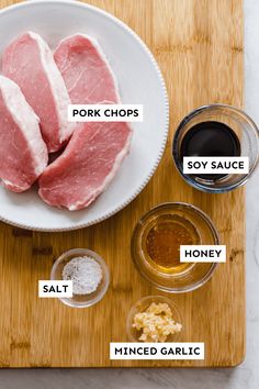 ingredients for pork chops laid out on a cutting board