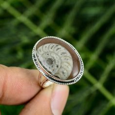 Large Ammonite Fossil Ring, Ammonite Ring, Genuine Fossil, Statement Ring, Fossil Jewelry, Unique Jewelry, Large Fossil Ring Note: We Use Good Quality Gemstone or 925 Solid Silver For Ring You Can Select Any Ring Size You Want From Drop Down Menu. Photos is Copyright All Right Reserved. ● Metal :- 925 Starling Silver ● Ring Size :- All Size Available ● This Ring :- Women's and Mane's ● Stone :- Ammonite Fossil ● Stone Shape :- Oval Shipping Information :- All The Parcels Will Be Shipped With In 1-2 Days Of Purchase... ● United States ( UPS, USPS, DHL Express ) ● Other Countries ( India Post ) ● Free Shipping Worldwide ● We Will Provide You Tracking Number ● Expedited / Express Upgrades ( On Point ) ● More Jewelry :- https://www.etsy.com/in-en/shop/QueenOfJewellry? Payment:- We Accept Payme Ammonite Ring, Fossil Ring, Fossil Jewelry, Ammonite Fossil, Jewelry Unique, Silver Gifts, Ring Gemstone, 925 Sterling Silver Earrings, Adjustable Ring