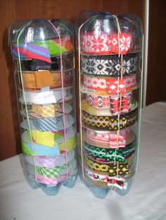 two clear containers filled with different types of ribbons