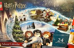 the lego harry potter calendar is on display in front of other christmas decorations and toys