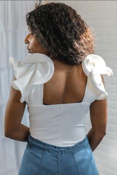 A knit top bodysuit featuring a solid color, a ruffled-trim short sleeves, an overlapping front design, square back outline Model is wearing a size small Back Outline, Ruffle Bodysuit, Design Square, Ruffle Sleeves, New Love, Front Design, One Shoulder Blouse, Knit Top, Short Sleeves