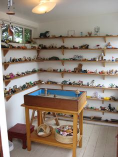 a room filled with lots of toys and shelves