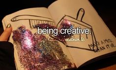 someone is holding an open book with glitter on it and the words being creative are written in cursive writing