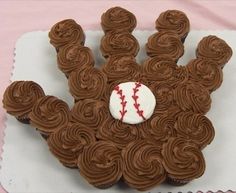 a cupcake shaped like a baseball glove