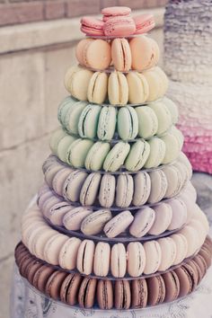 a stack of macaroons sitting on top of a table