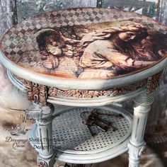 an old stool with a painting on it